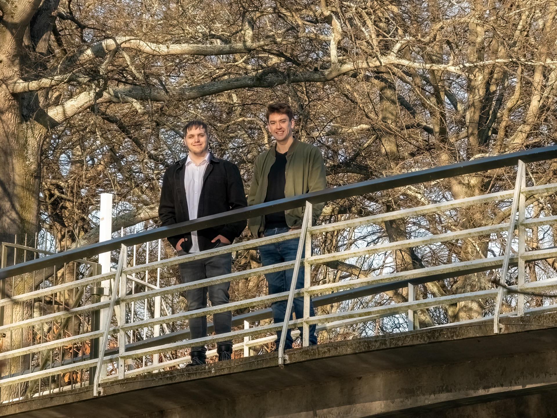 Egg Academy founders Kane and Juniper standing on a bridge.
